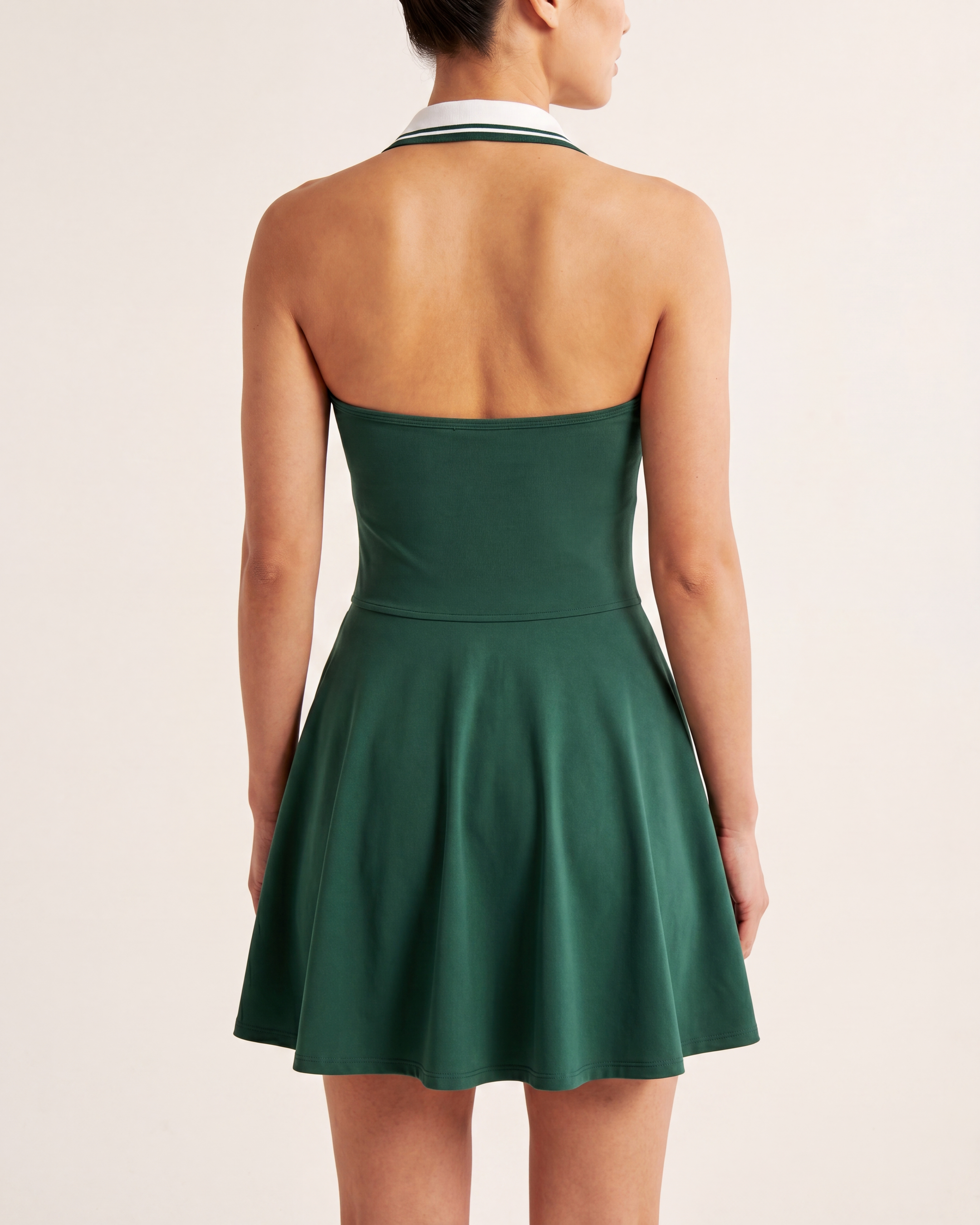 The Court Dress in Forest, back on-body view showing the open halter back and A-line skirt.