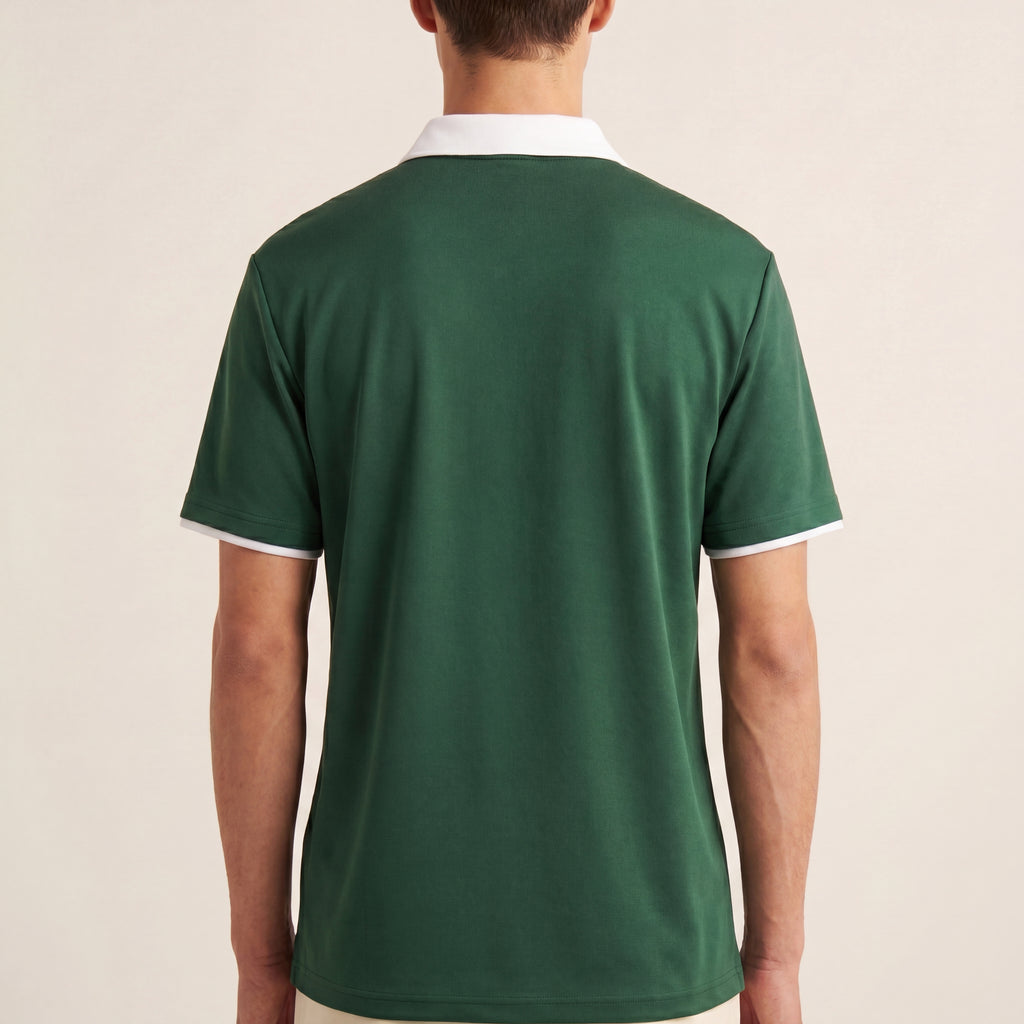 The Court Polo in Dark Green, back on-body view showing the white contrast collar, sleeve trim, relaxed drape, and blank back.
