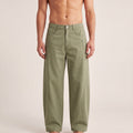 The Barrel Pant in Gray Green, front on-body view showing the waistband, utility pockets, and relaxed barrel-leg shape.