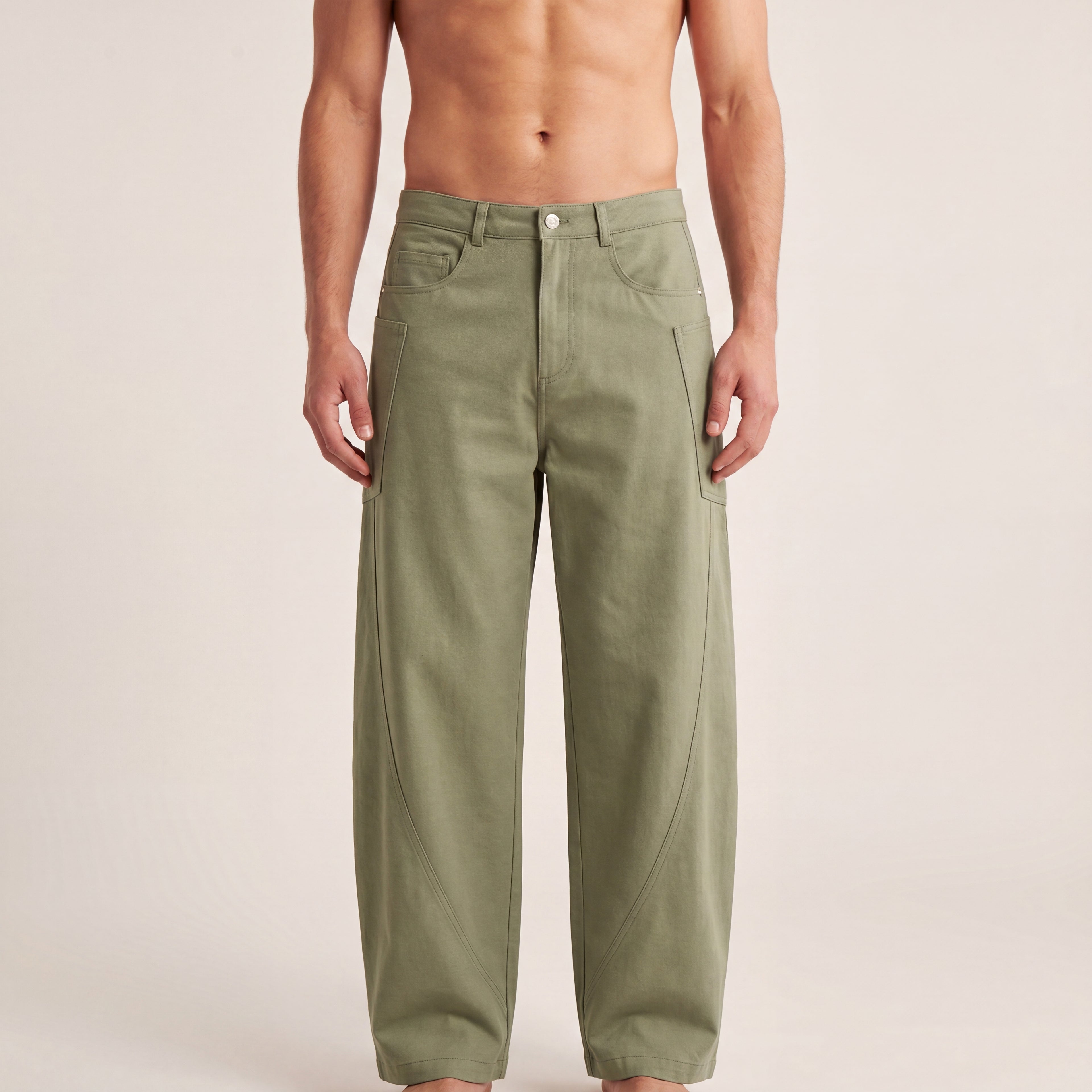 The Barrel Pant in Gray Green, front on-body view showing the waistband, utility pockets, and relaxed barrel-leg shape.