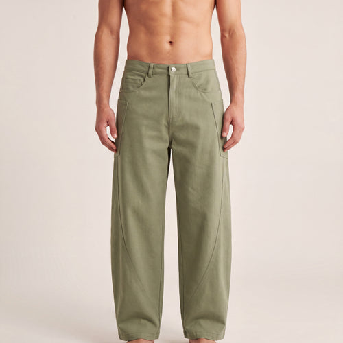 The Barrel Pant in Gray Green, front on-body view showing the waistband, utility pockets, and relaxed barrel-leg shape.