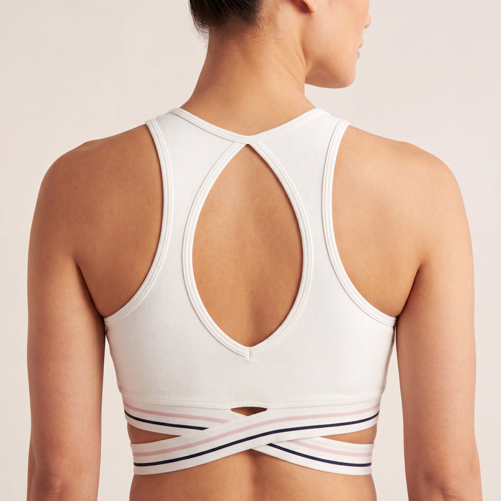 The Court Bra in White, back on-body view showing the open racerback shape and criss-cross striped band.