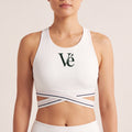 The Court Bra in White, front on-body view showing the forest Vé mark and criss-cross striped band.