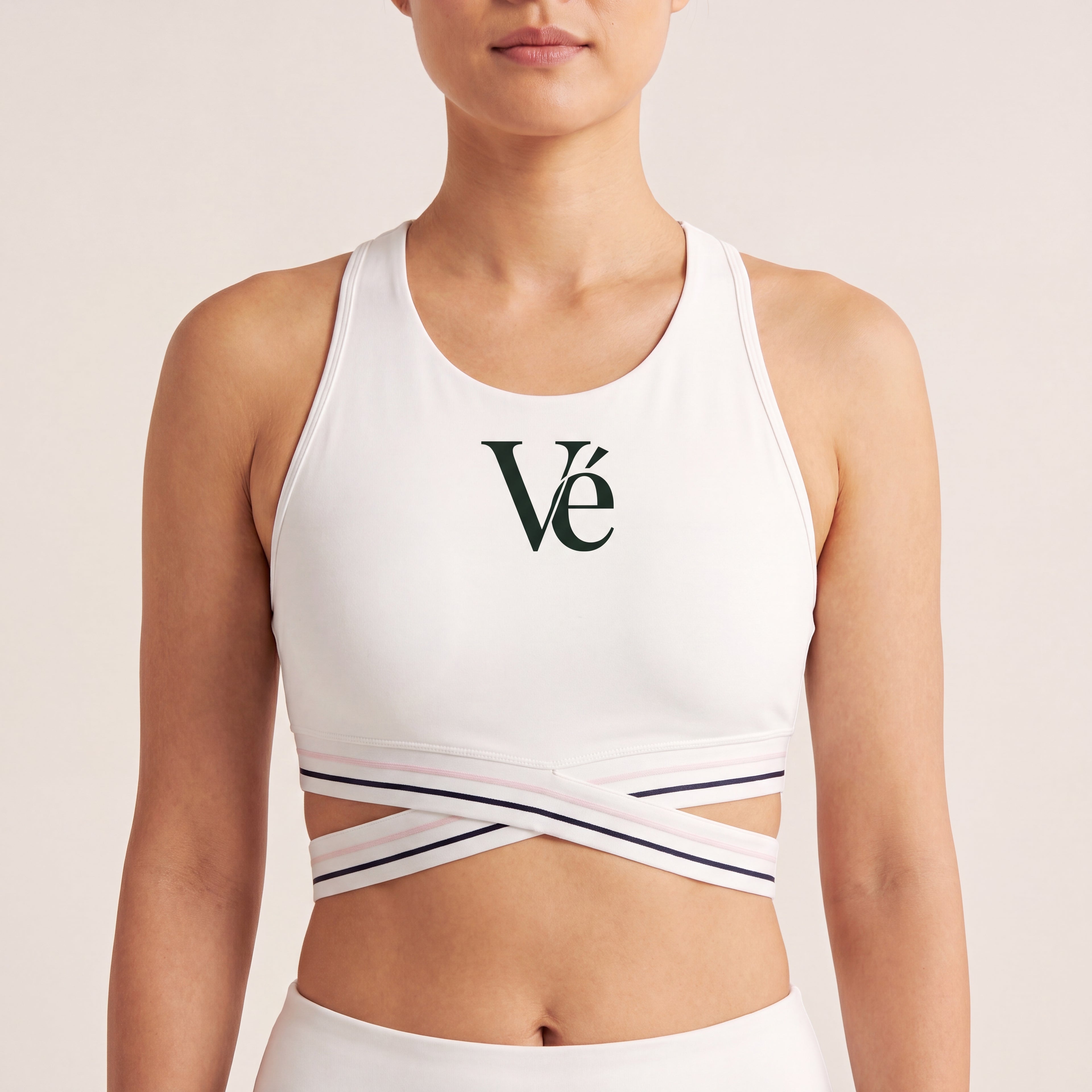 The Court Bra in White, front on-body view showing the forest Vé mark and criss-cross striped band.